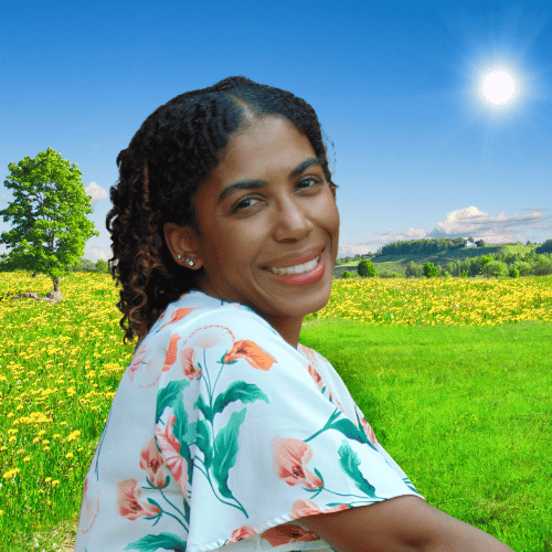 MJ Wright, a Black Caribbean therapist, smiling warmly at the camera.